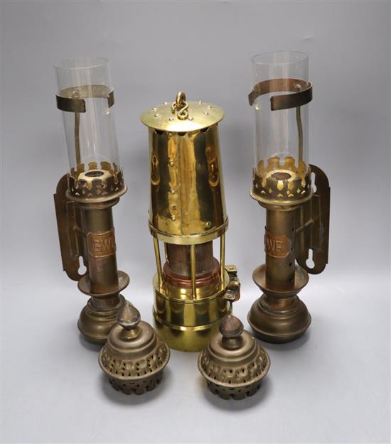 Railway interest: A pair of GWR wall mounted brass oil lamps, together with a protector lamp and lighting miners lamp